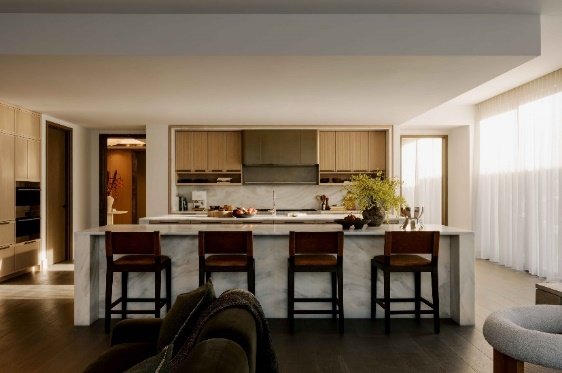 A kitchen with a bar and chairs
AI-generated content may be incorrect.